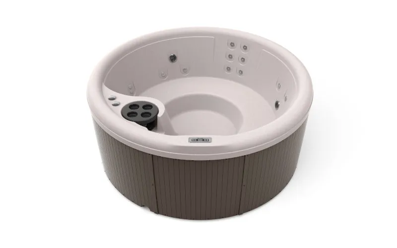 FreeFlow Aptos Whirlpool in runder Form mit komfortablem Innenraum und eleganter Holzoptik.