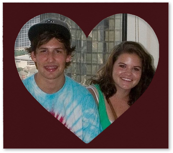 Smiling young man in a tie-dye shirt and baseball cap and woman with curly hair in a green top inside a heart-shaped frame.