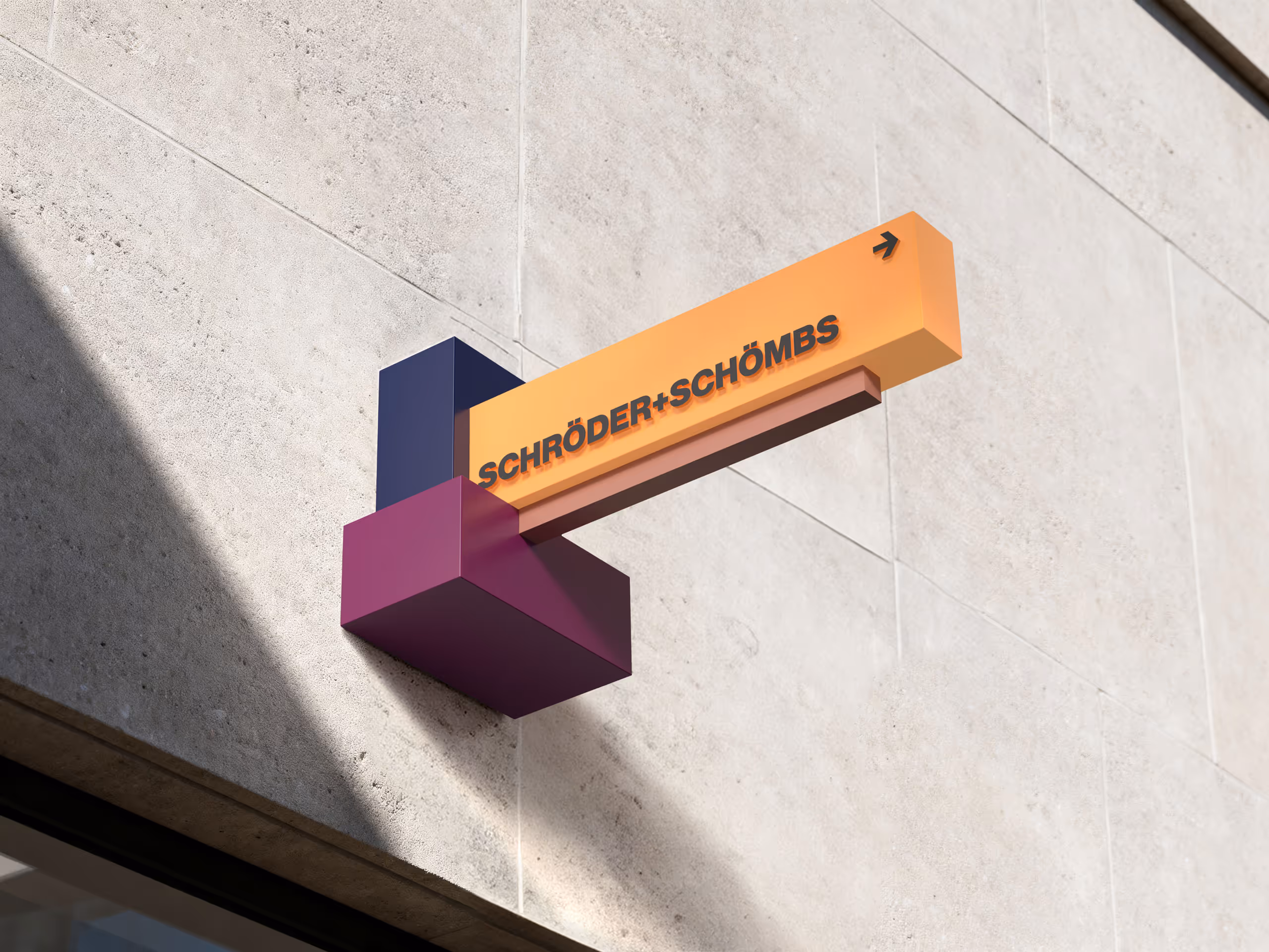 Modern geometric wall sign with blocks in purple, navy, and orange displaying the text 'SCHRÖDER+SCHÖMBS' and a small arrow.