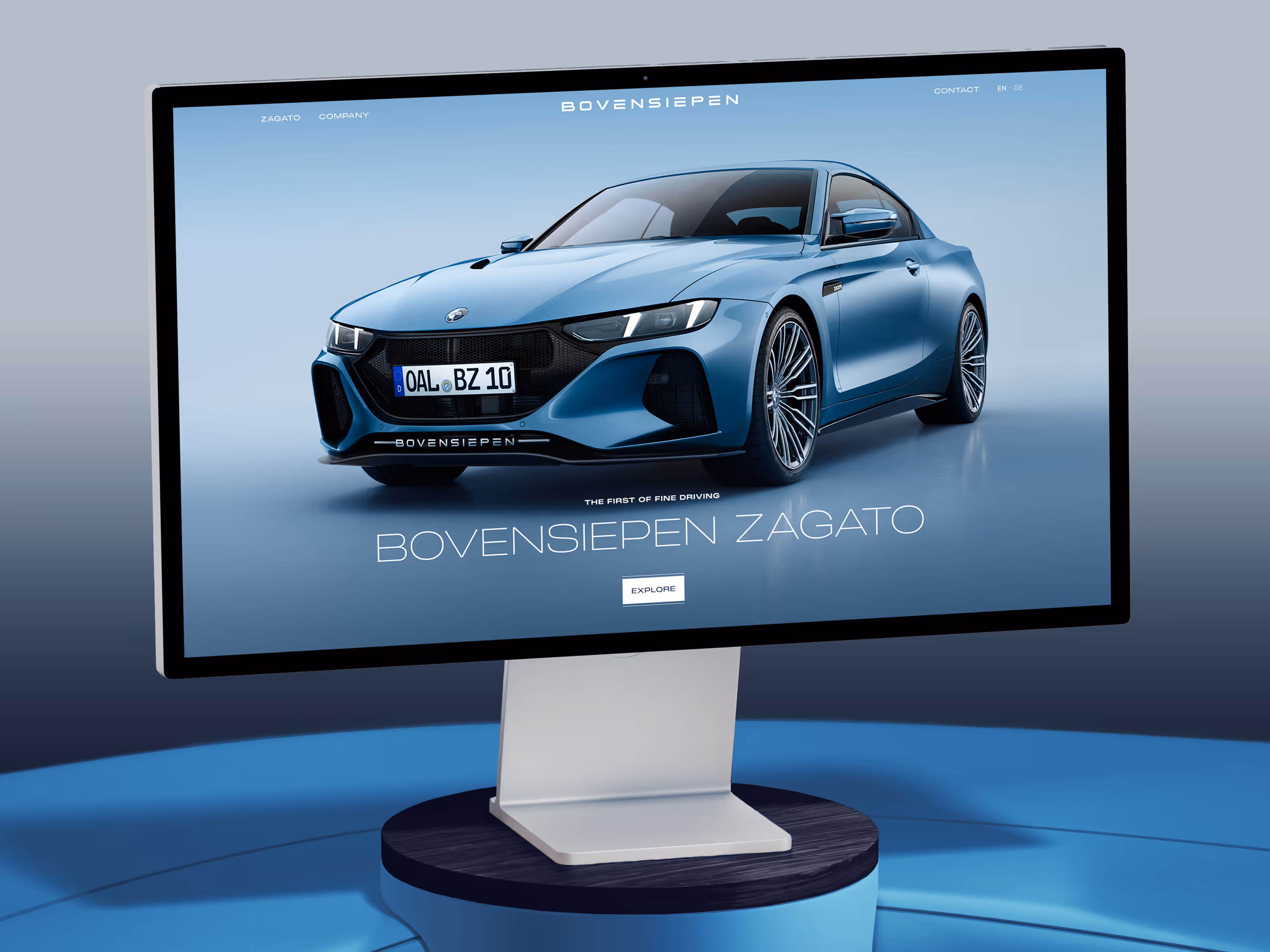 Computer monitor displaying a blue Bovensiepen Zagato sports car on a light blue background with navigation options and an explore button.