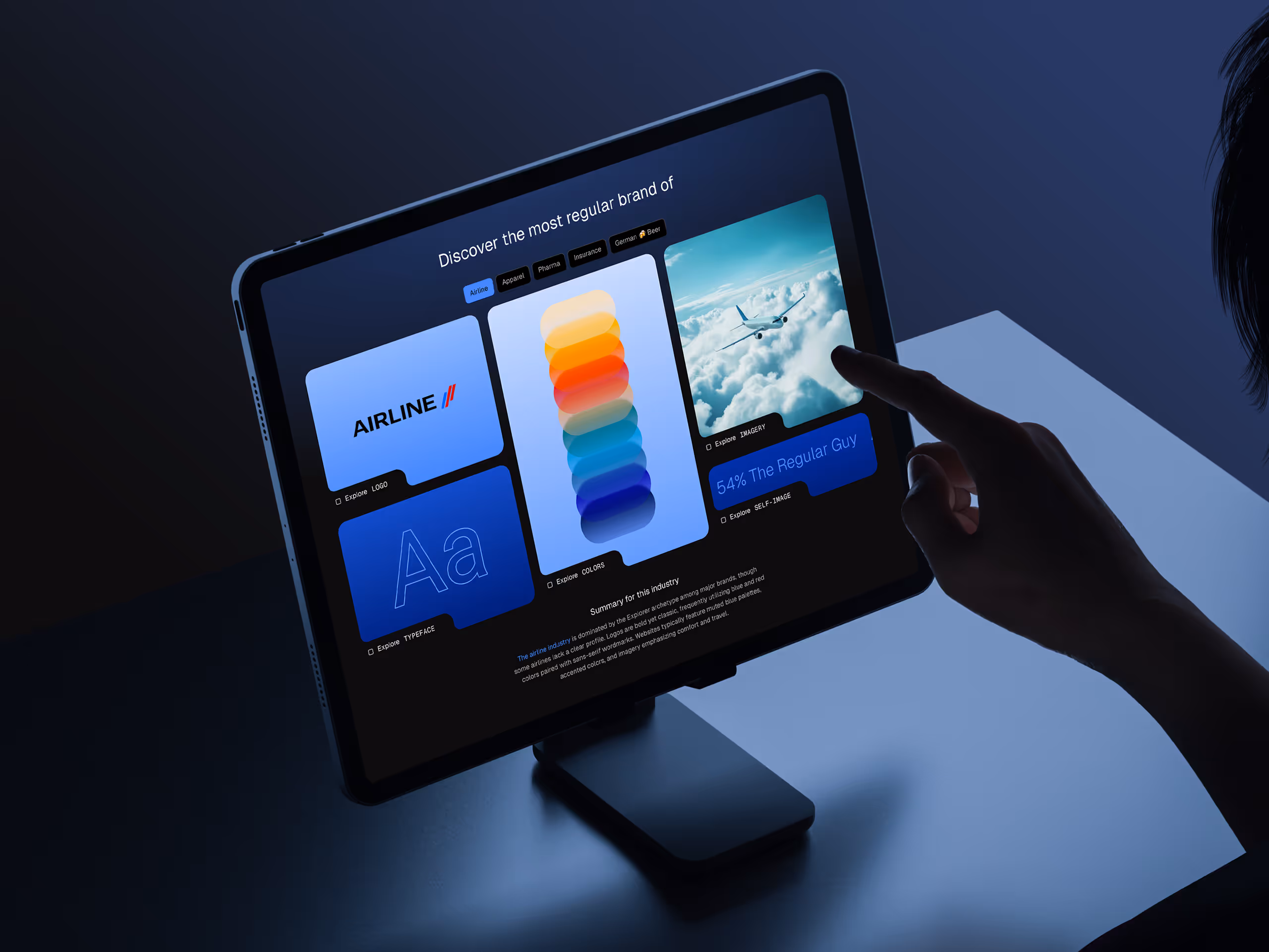 Hand interacting with a tablet displaying a dashboard showing airline branding elements including logo, colors, and imagery.