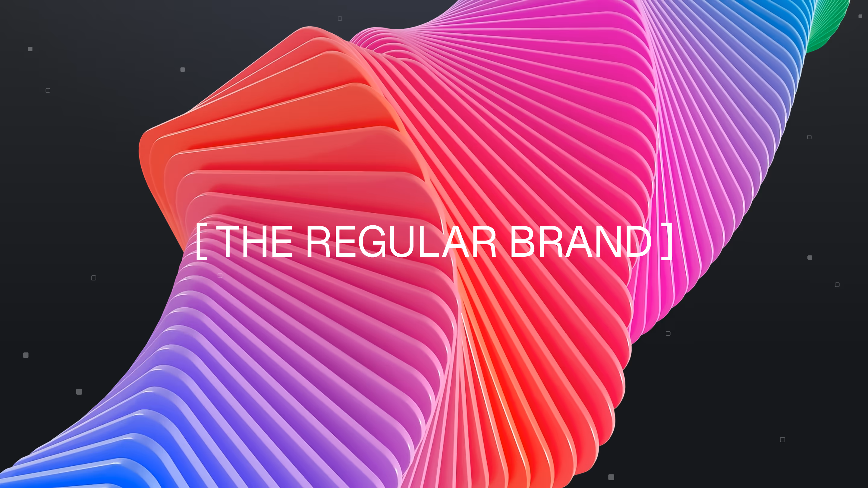 Curved, layered ribbon in gradient colors from blue to red to pink on a dark background with text '[ THE REGULAR BRAND ]'.