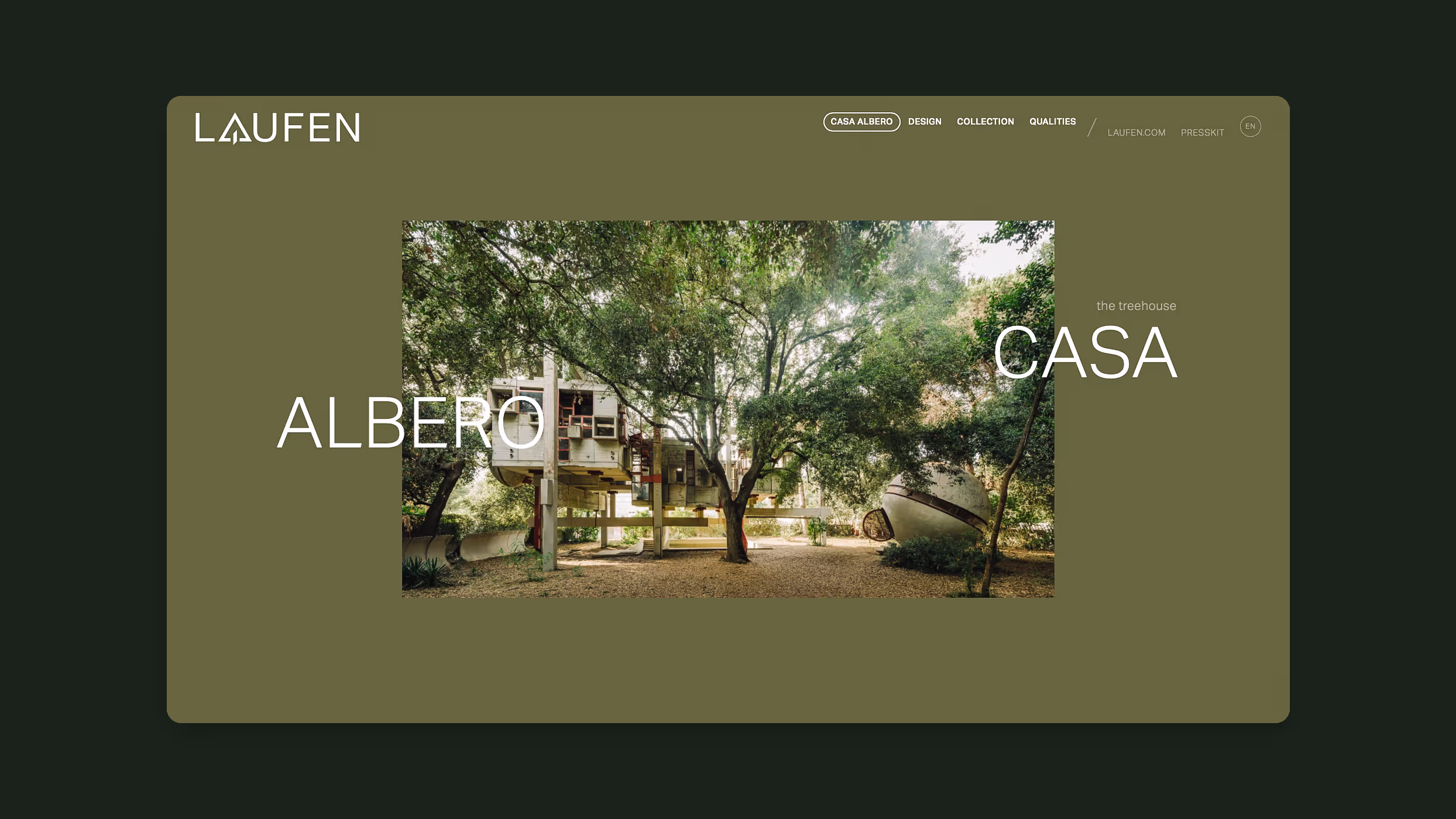 Modern treehouse with geometric design elevated among green trees in a wooded area.