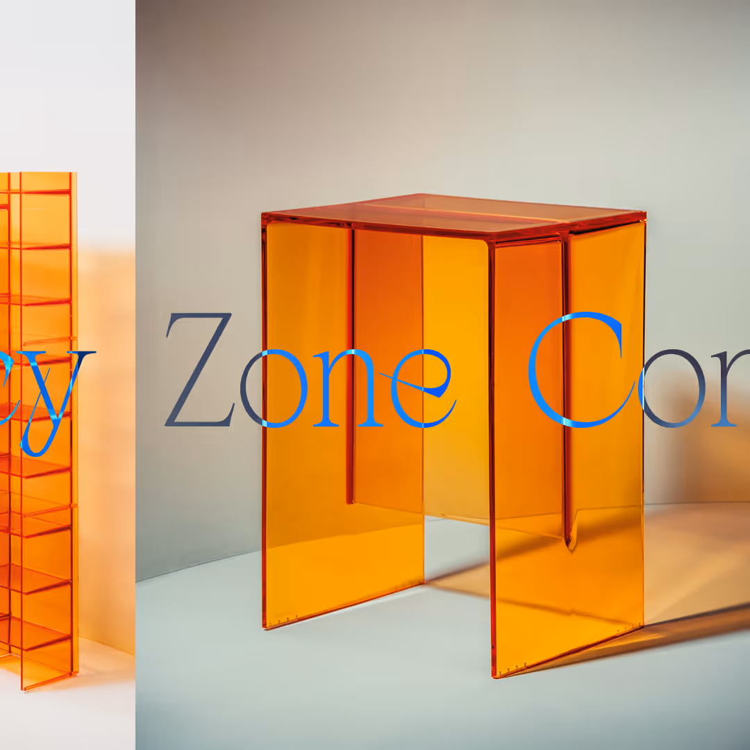 Transparent orange acrylic square table with a unique cut-out design on a light background.