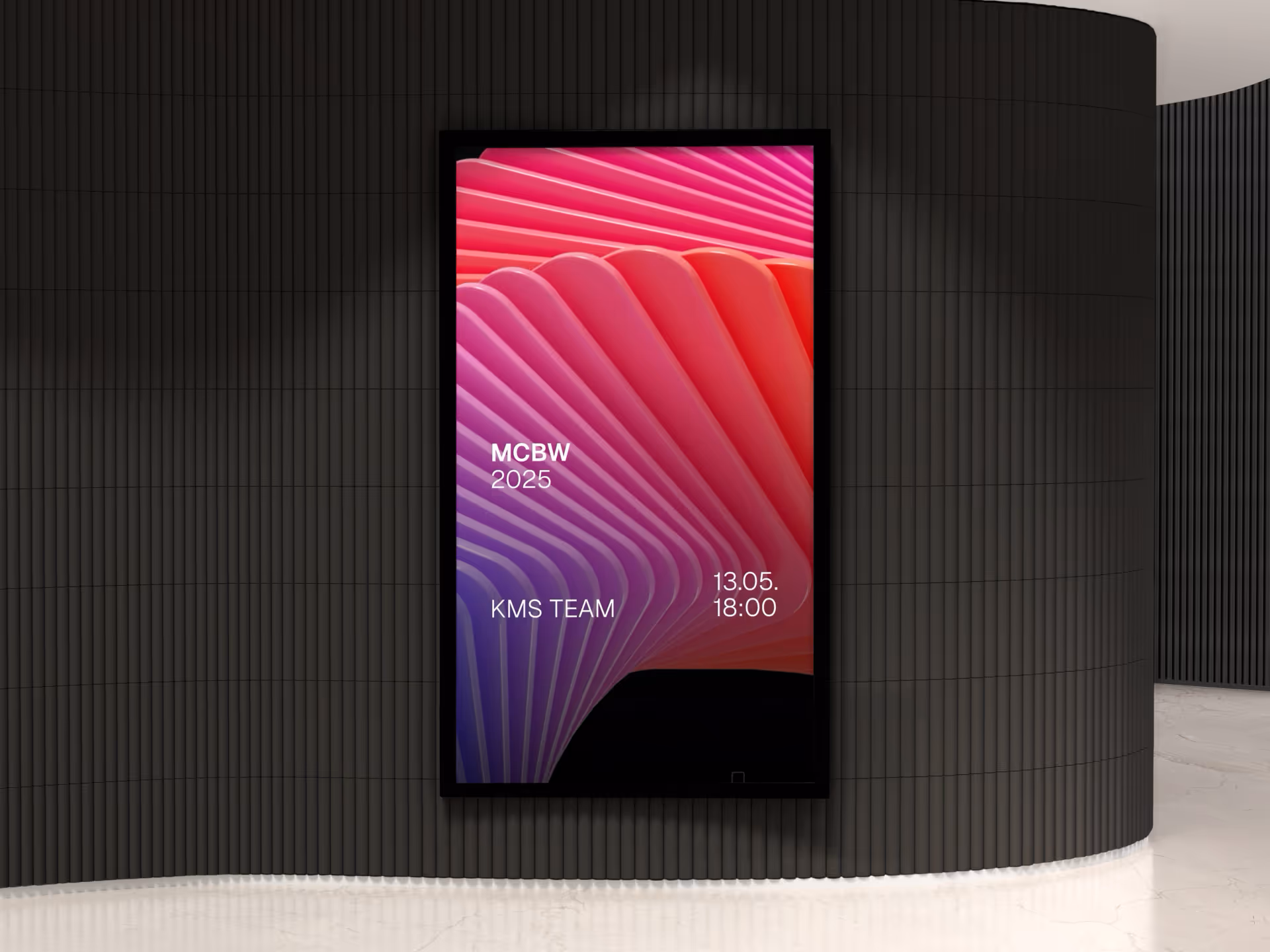 Digital billboard on a dark curved wall displaying colorful abstract waves with text MCBW 2025, KMS TEAM, and date 13.05. 18:00.