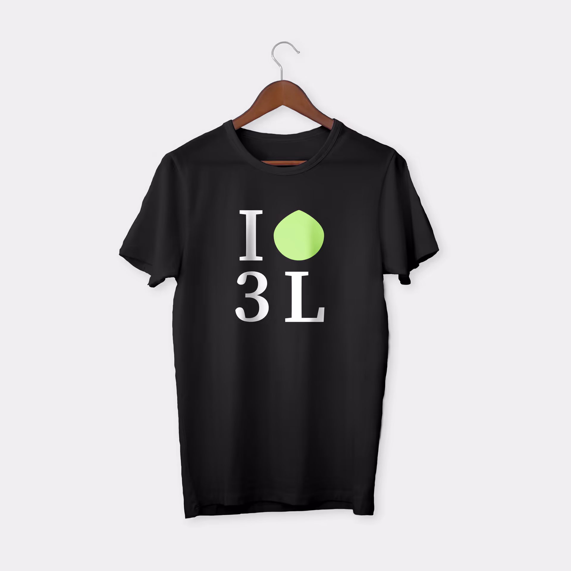 Black T-shirt on a wooden hanger with a design showing 'I' above '3 L' and a green leaf shape between I and 3.