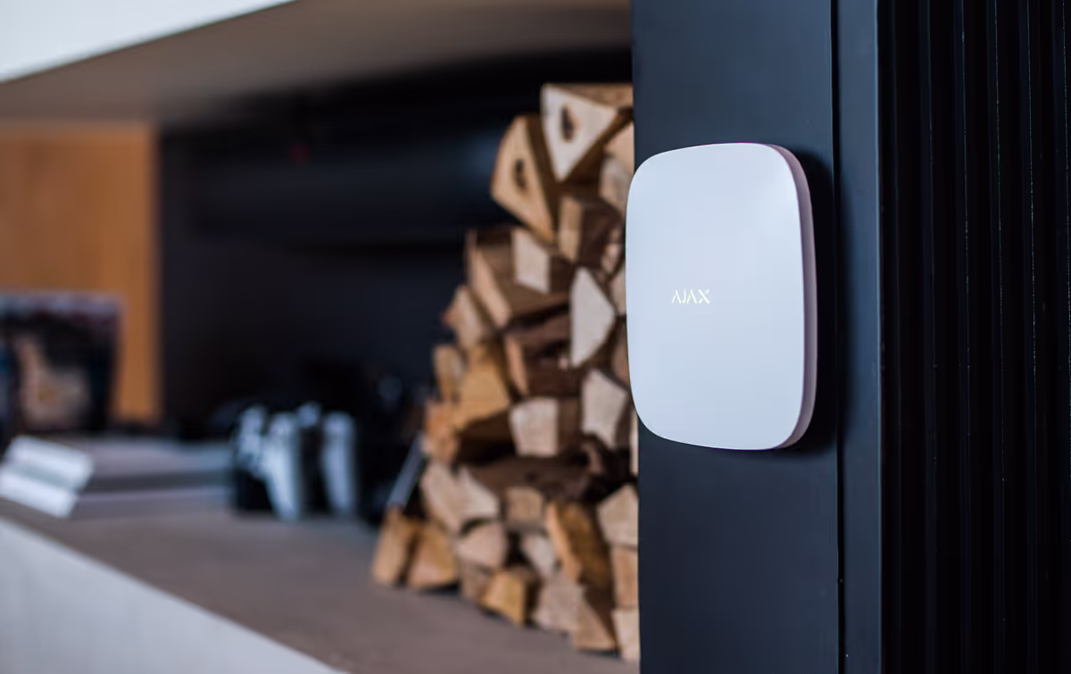 Ajax security system sensor transmitting an alarm signal to the hub using encrypted wireless communication