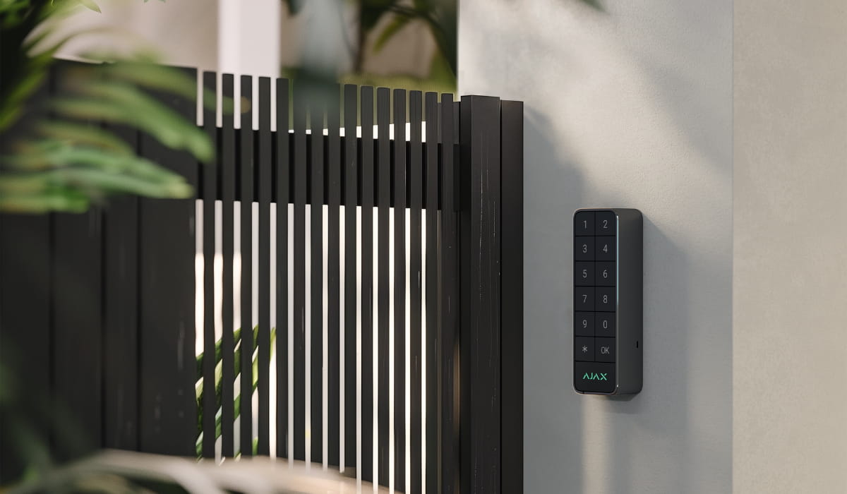 Ajax keypad installed beside a residential gate for individual access control