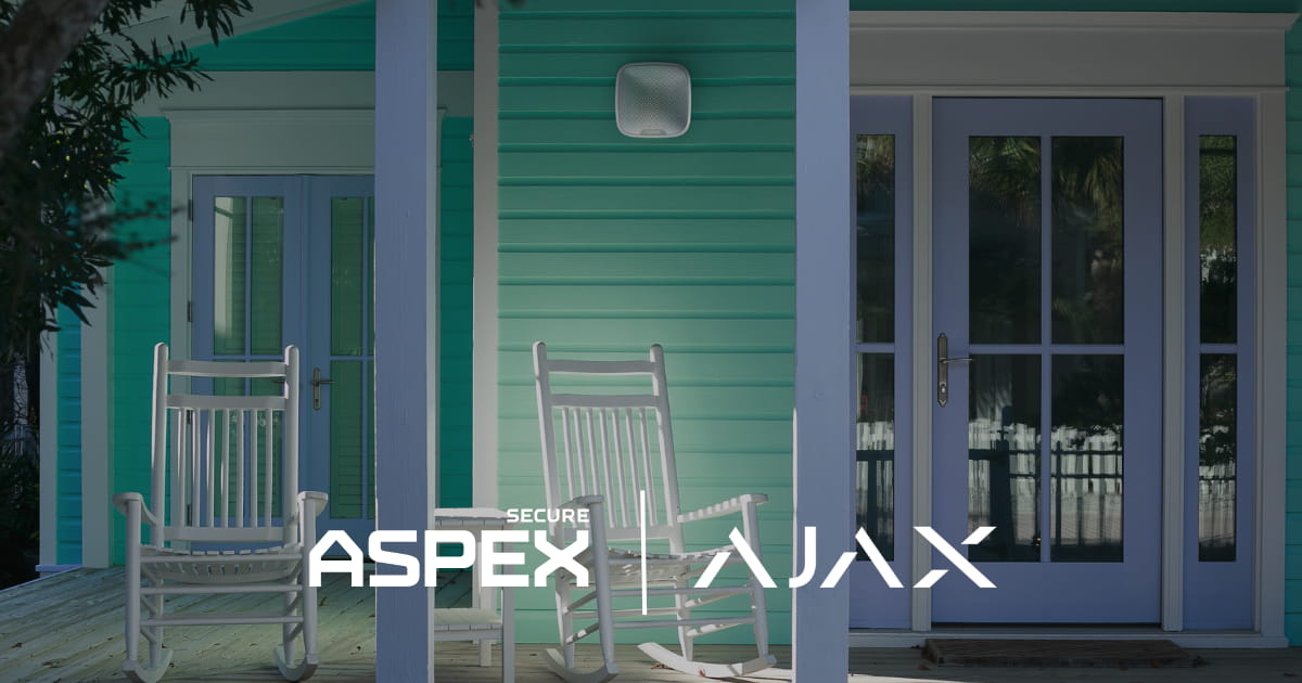 Exterior Ajax security camera overlooking a home's front entrance.