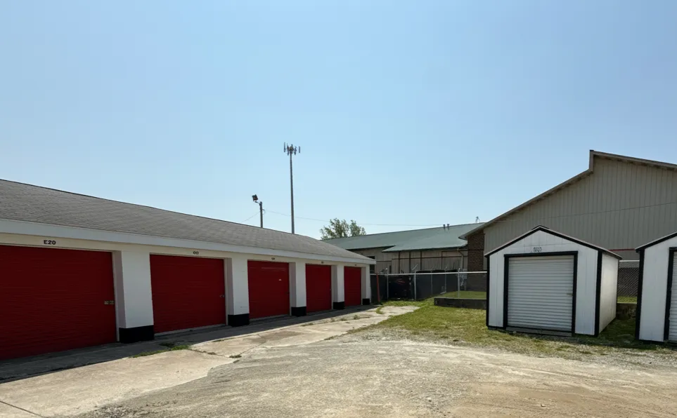 Drive up storage units with red and white roll up doors at our Kokomo IN storage location
