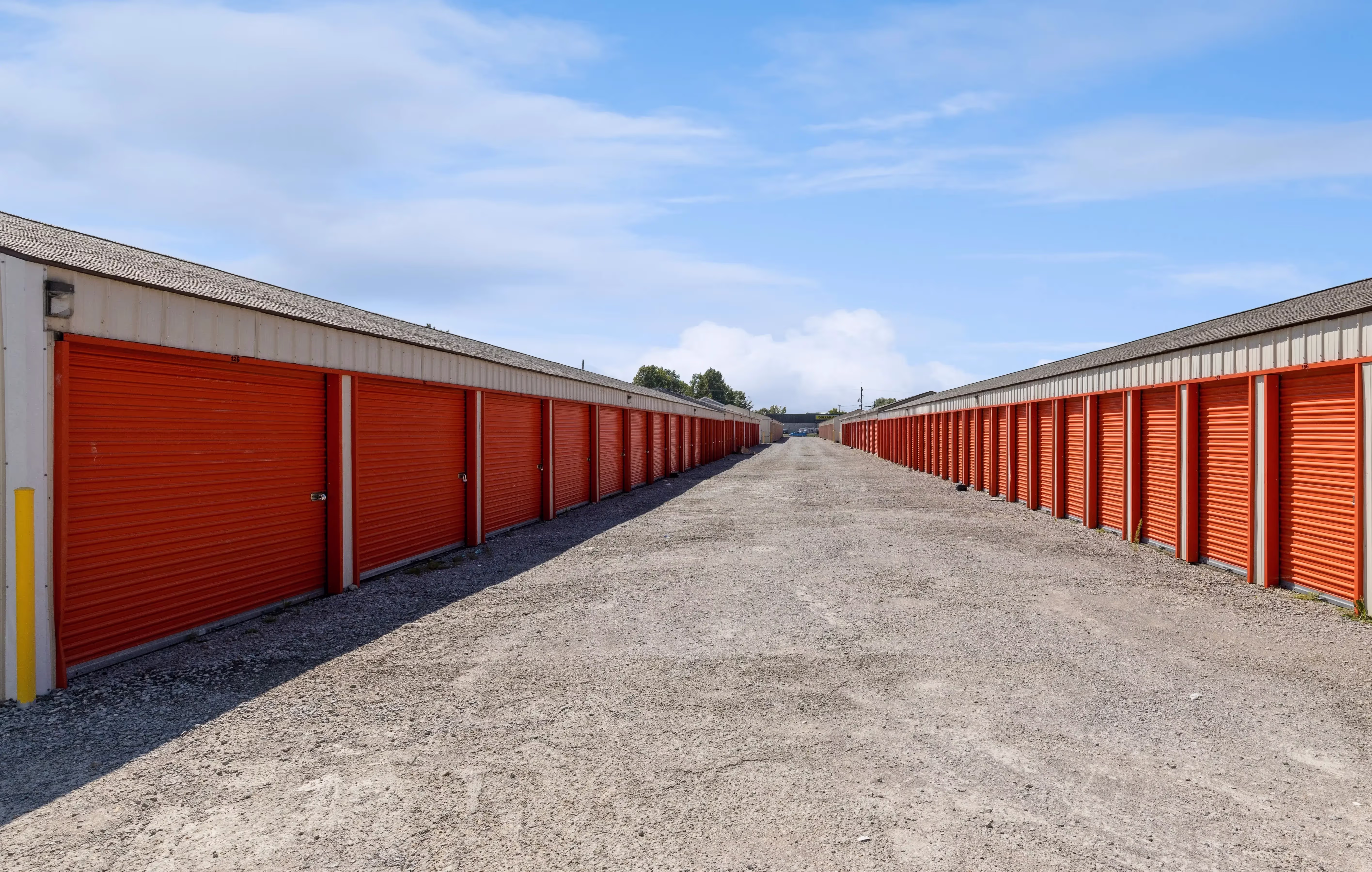 Row of orange door storage units with gravel driveways at our Batavia OH facility