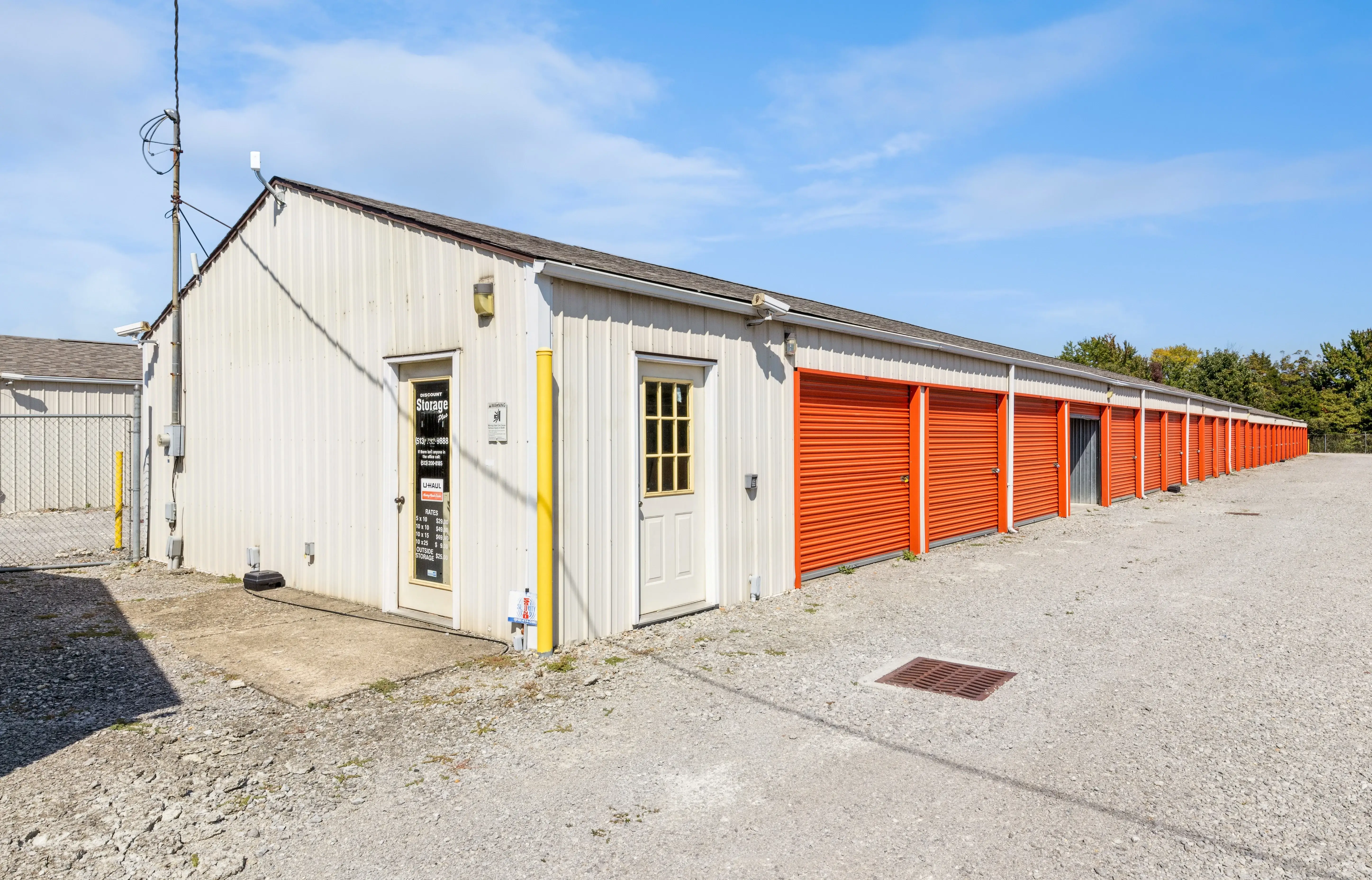 Small office building and drive up storage units with orange doors at our Batavia OH facility
