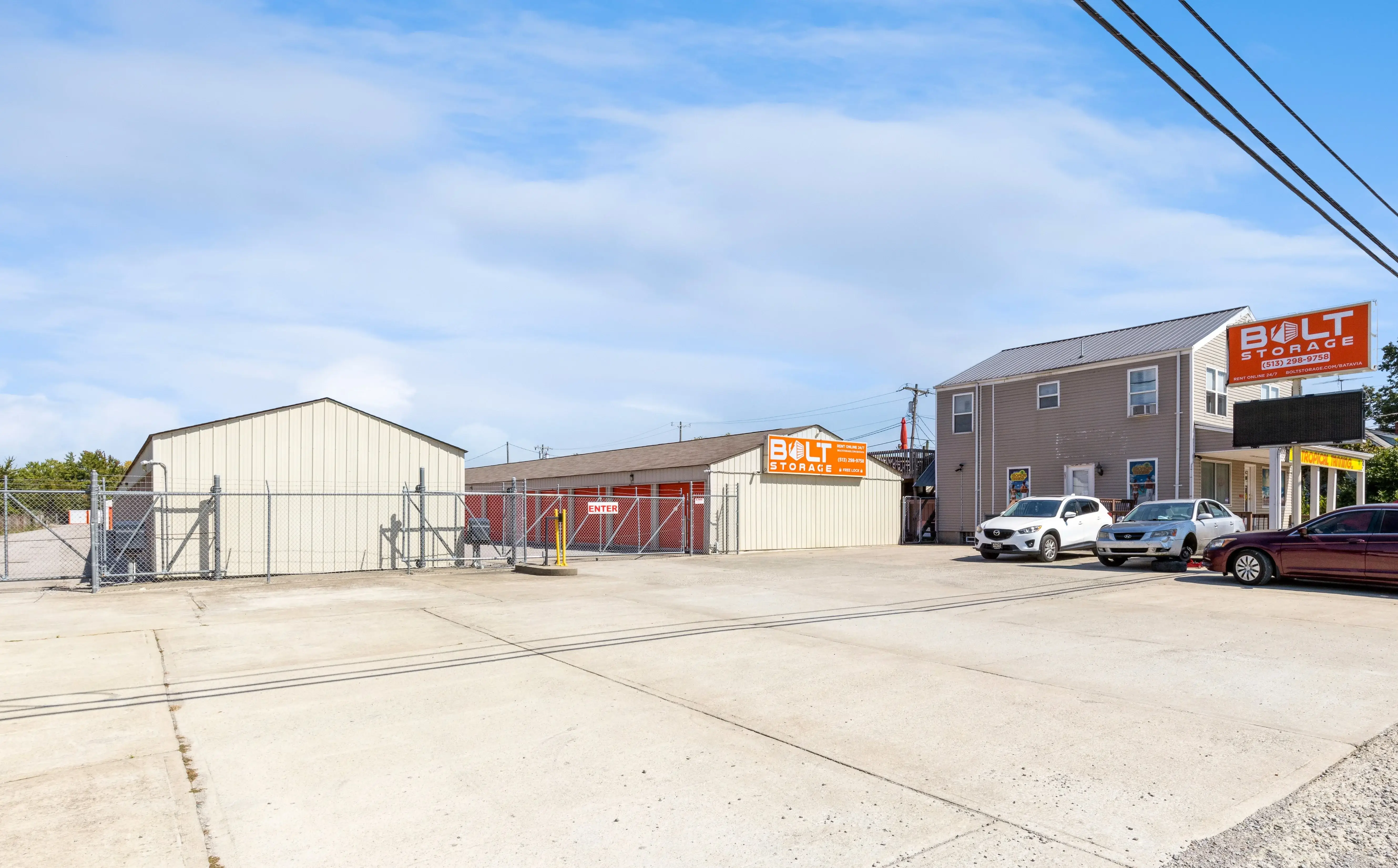 Gated entrance to our Batavia OH storage facility with drive up units visible beyond the fence