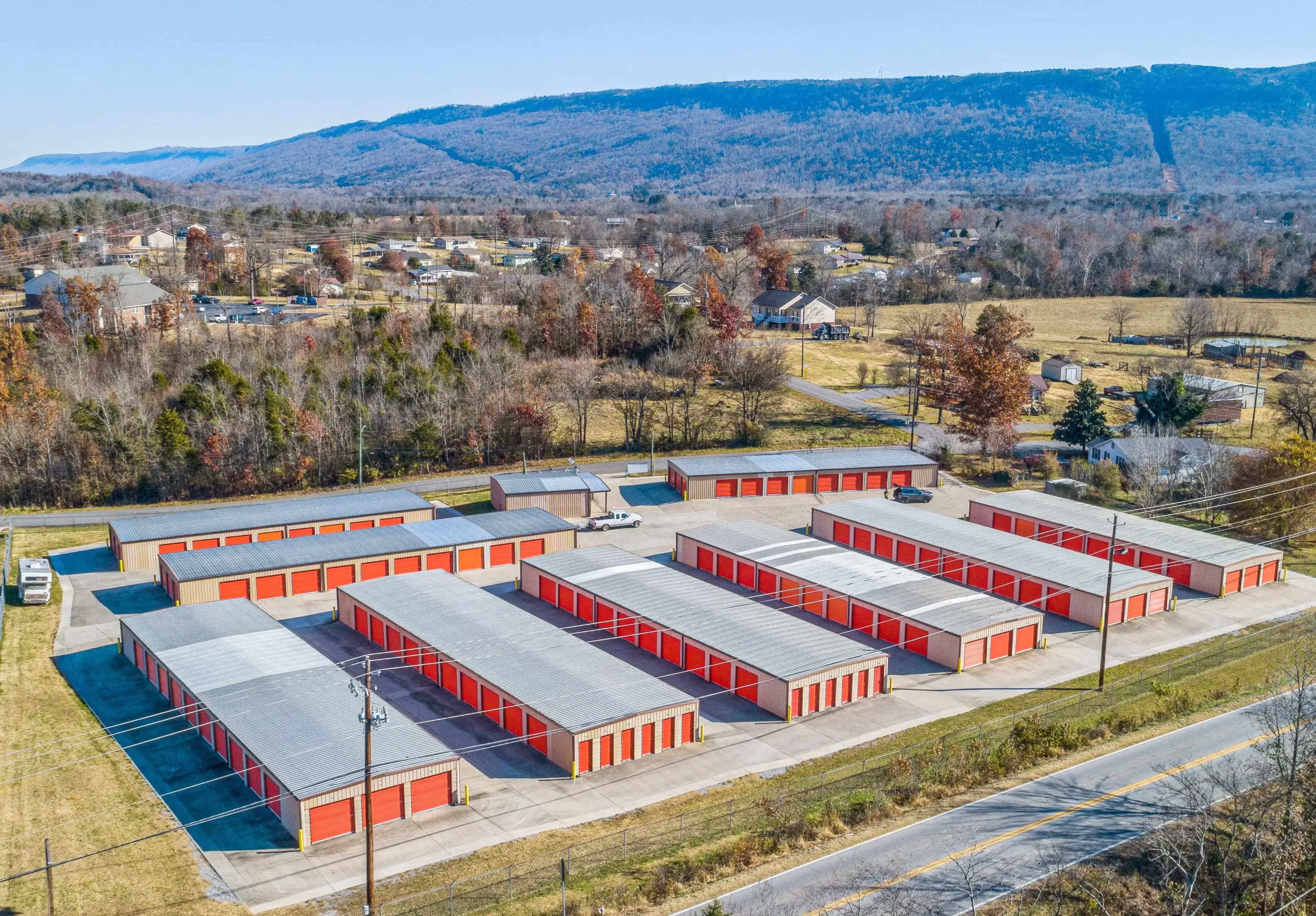 Aerial photo highlighting the layout of red door storage buildings against a mountain backdrop at our Trenton GA location
