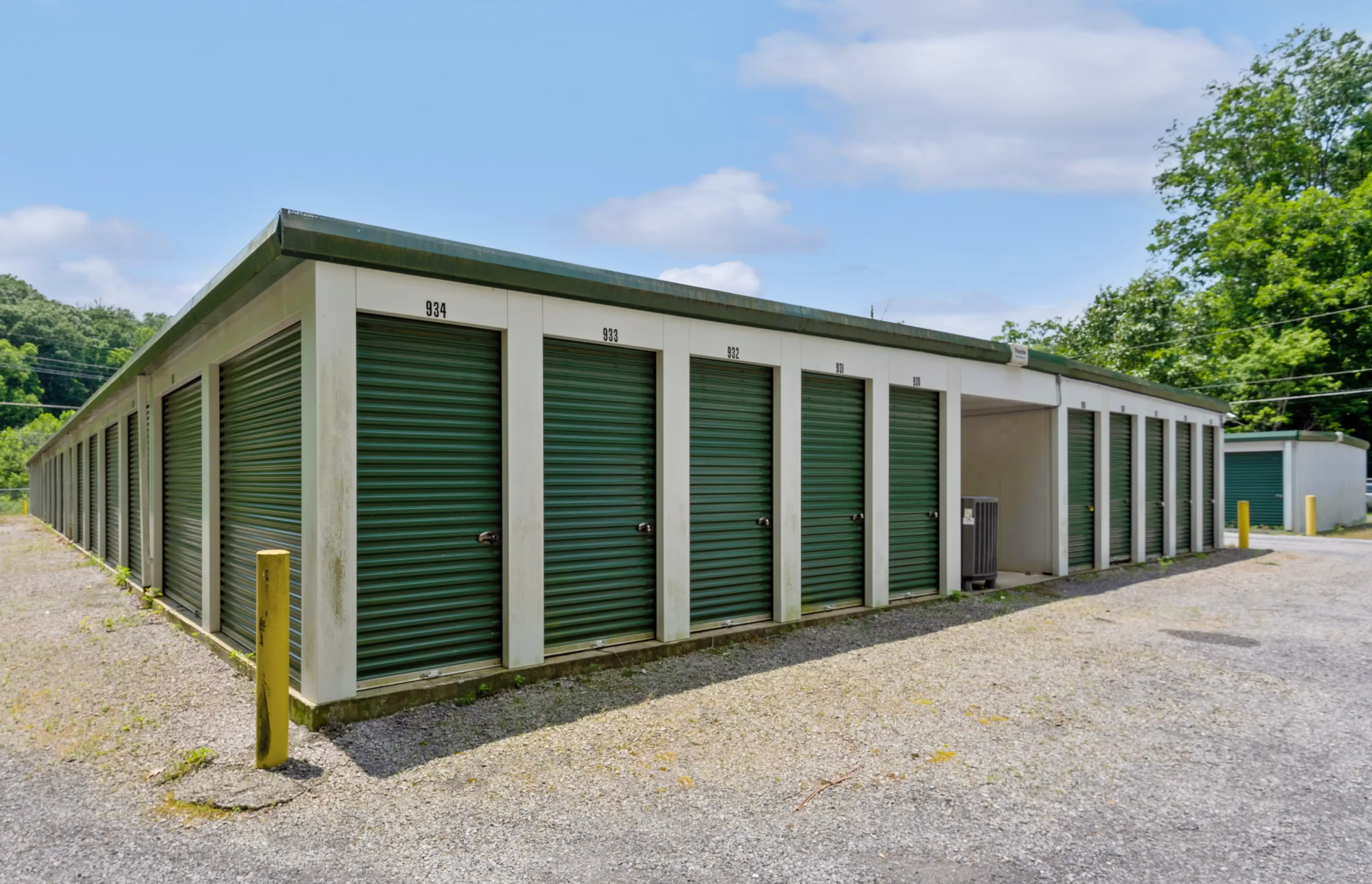 Angled view of drive up storage units with green doors at our Abingdon VA location