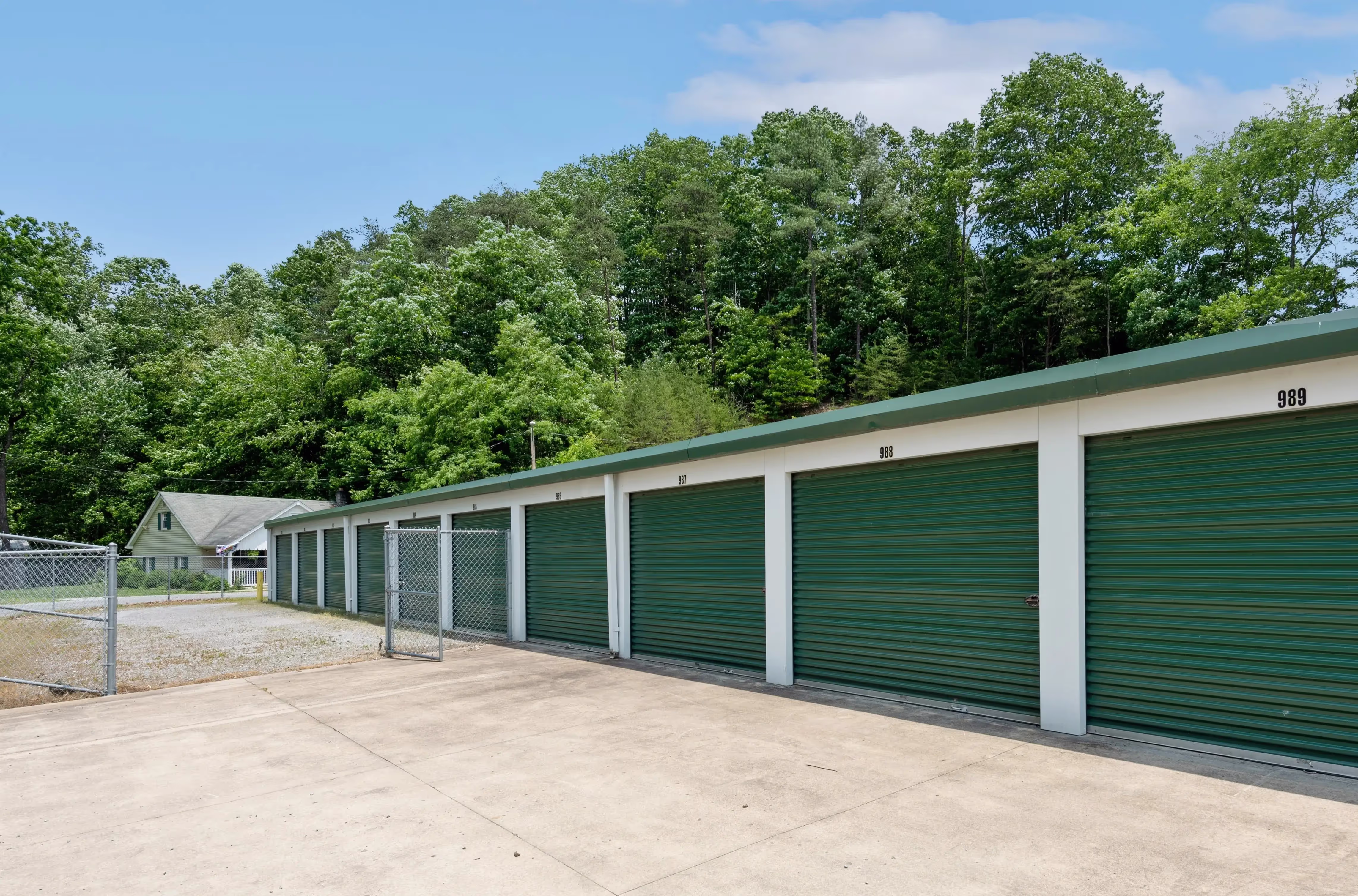 Exterior view of drive up storage units with green roll up doors at our Abingdon VA facility
