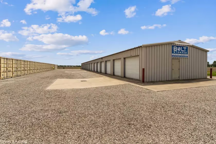 Exterior view of drive up storage buildings with tan doors at our Bowling Green Ohio facility