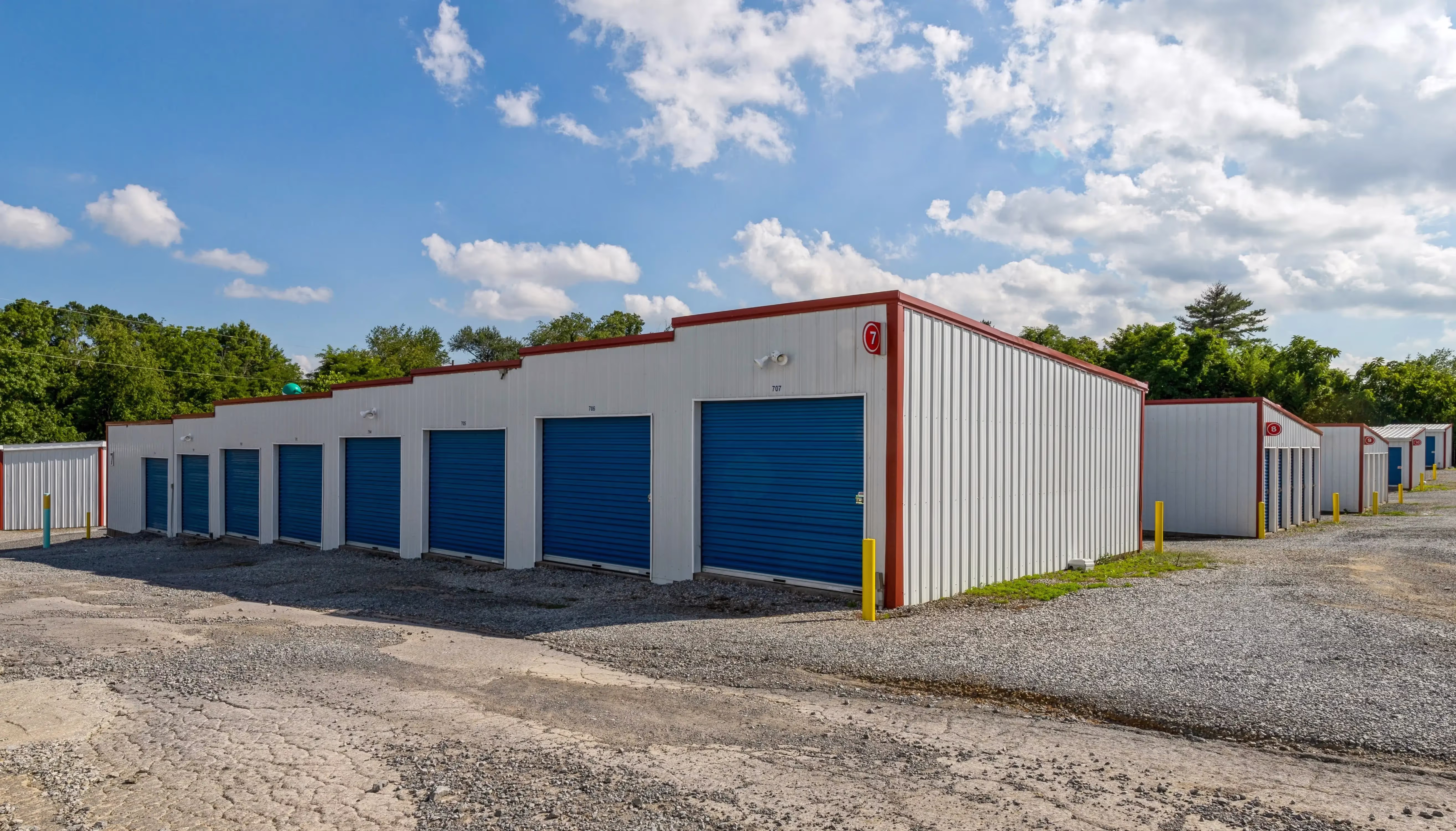 Exterior view of drive up storage units with blue roll up doors at our Bristol VA facility