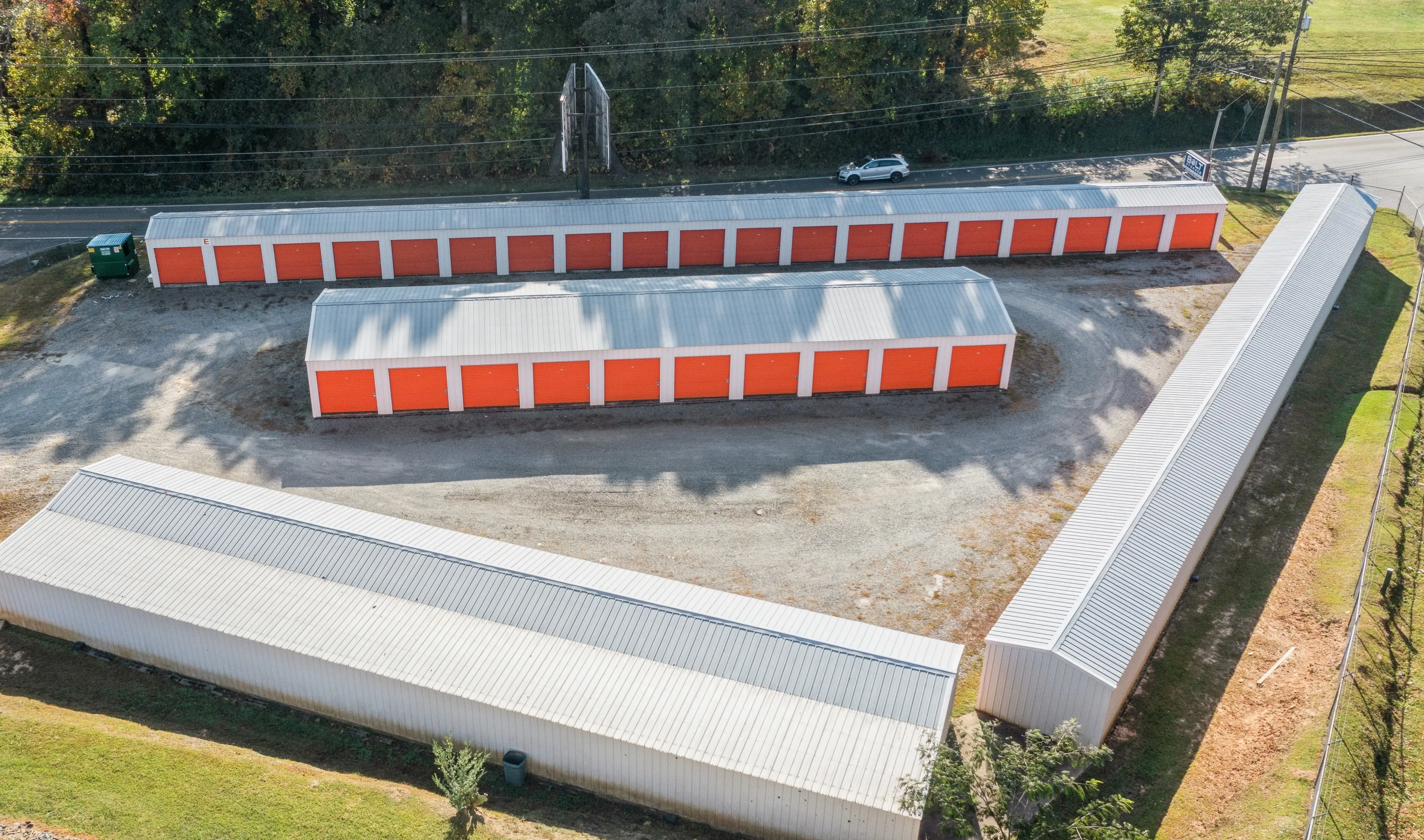Aerial view of gated storage facility in Ellijay GA with several rows of drive up units