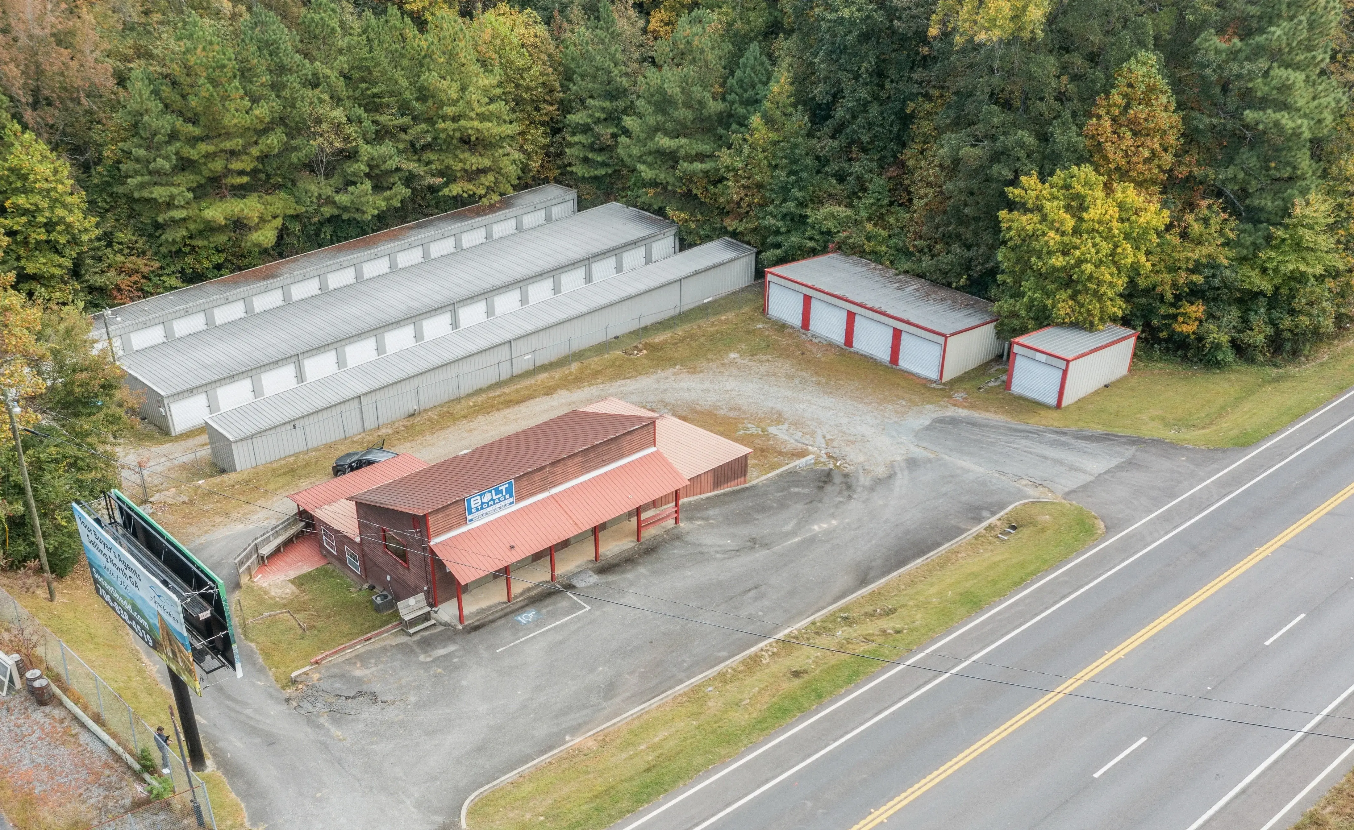Aerial view of our Ellijay GA self storage facility with multiple rows of drive up units beside the roadway