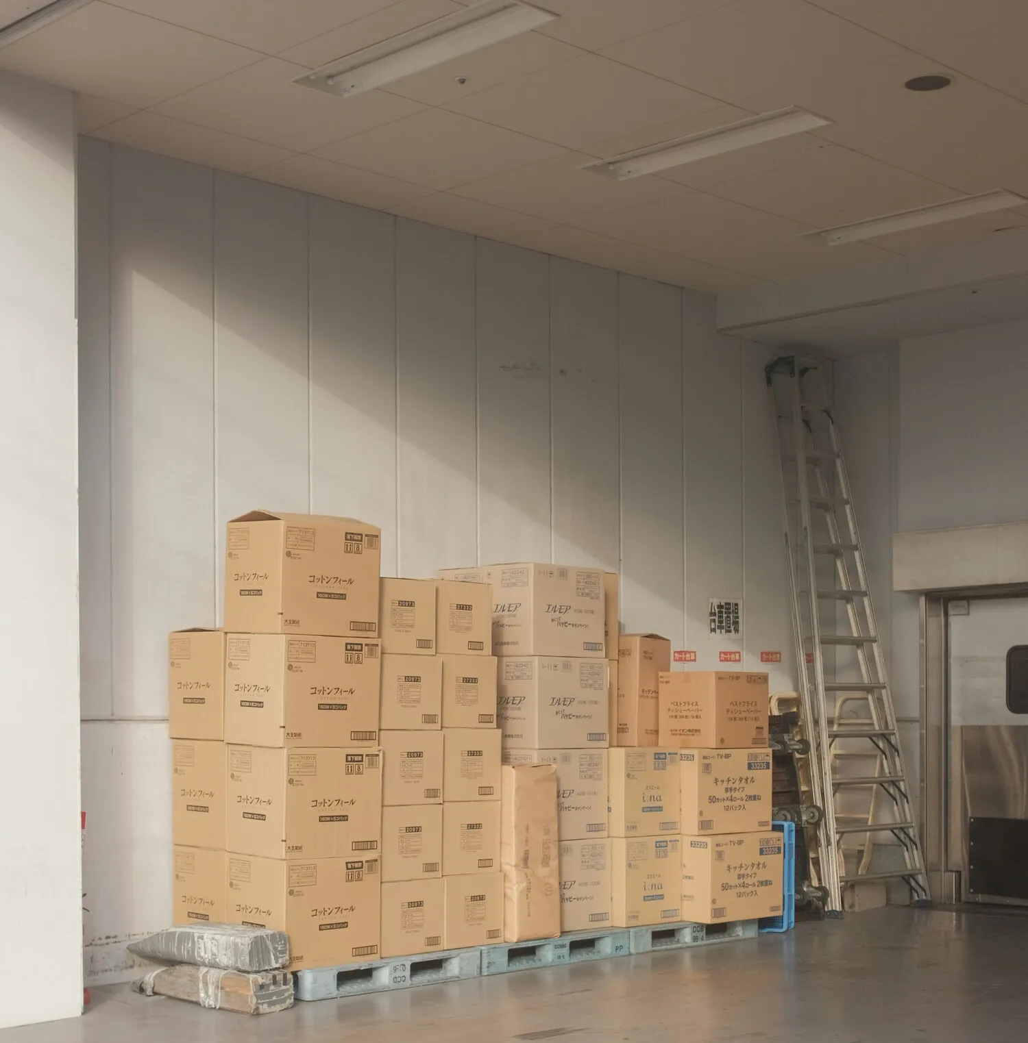 a pile of boxes over some pallets