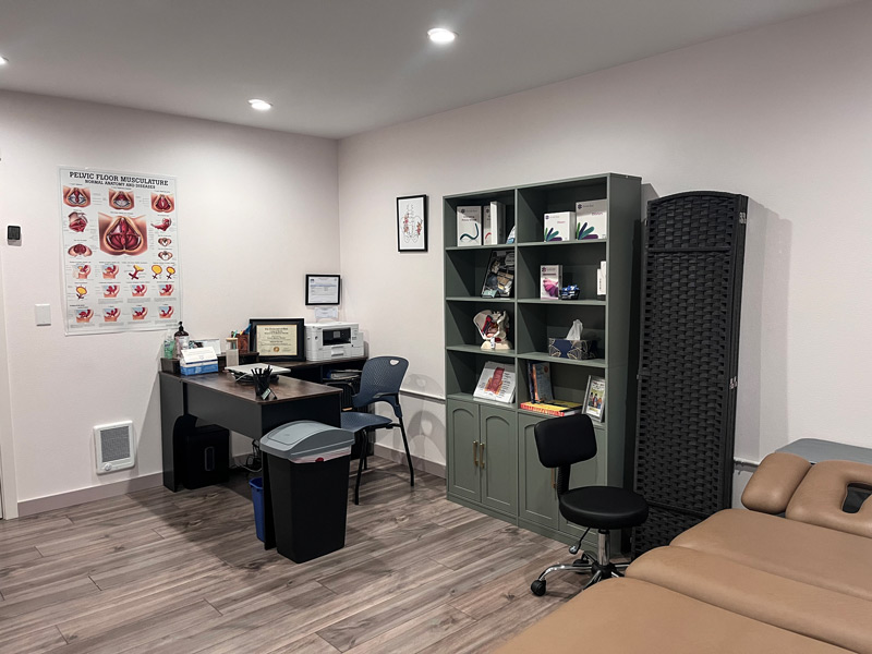 physical therapy office with desk and chair for patients