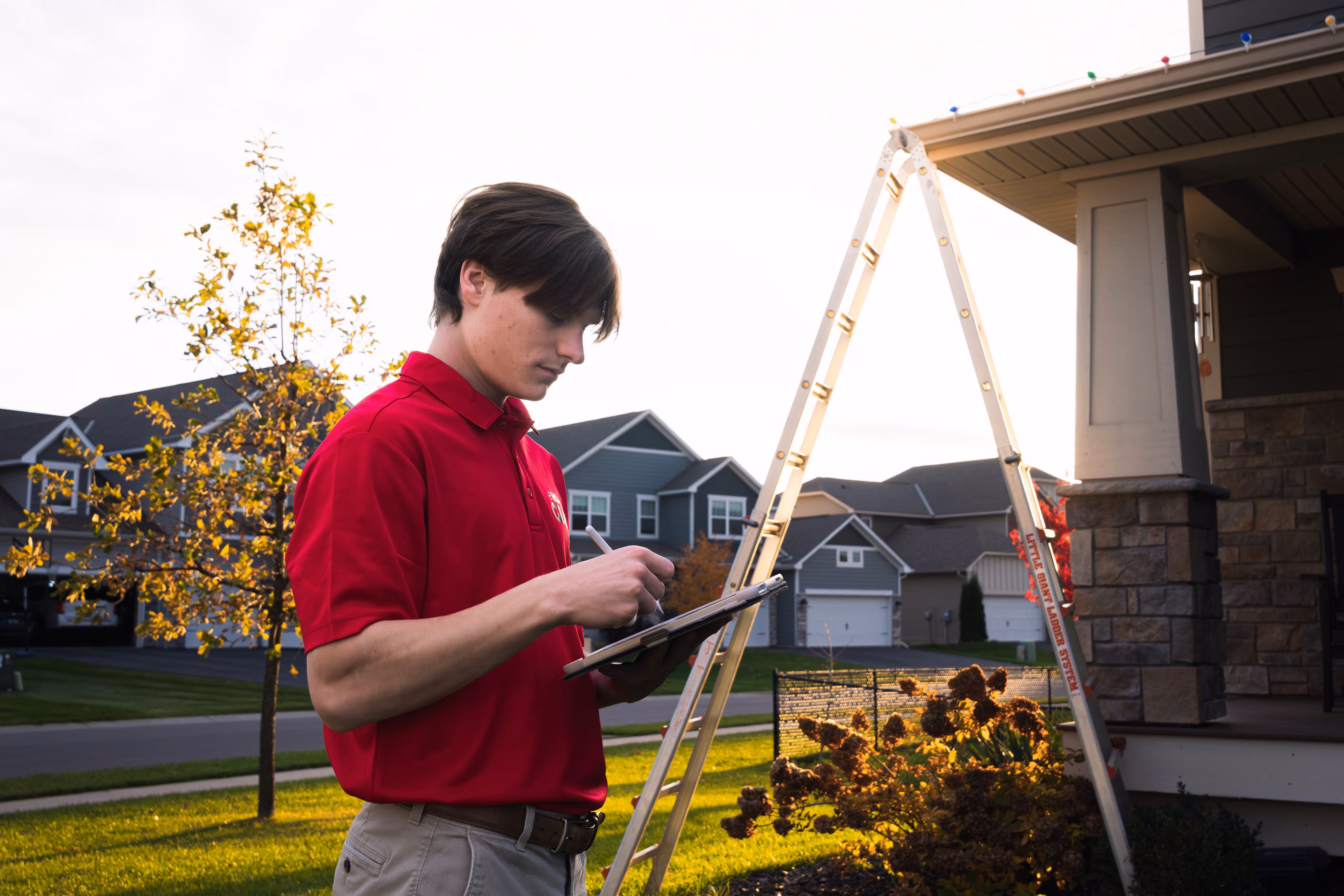 Employee designing a professional Christmas light display.