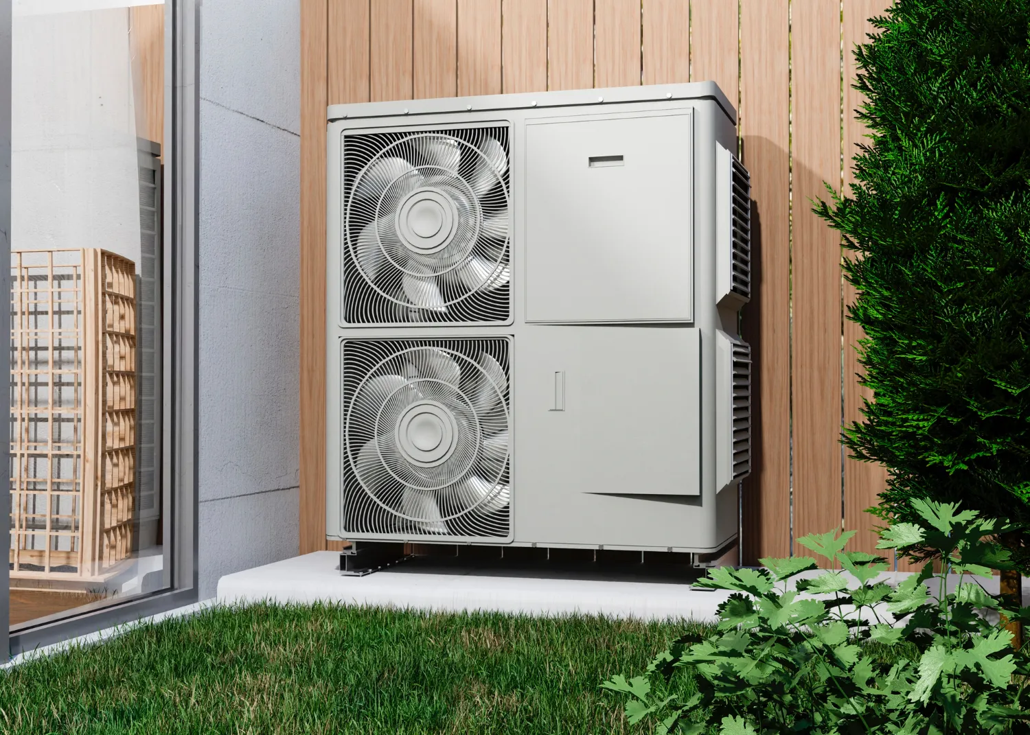 Large white air source heat pump installed outside on grassy area
