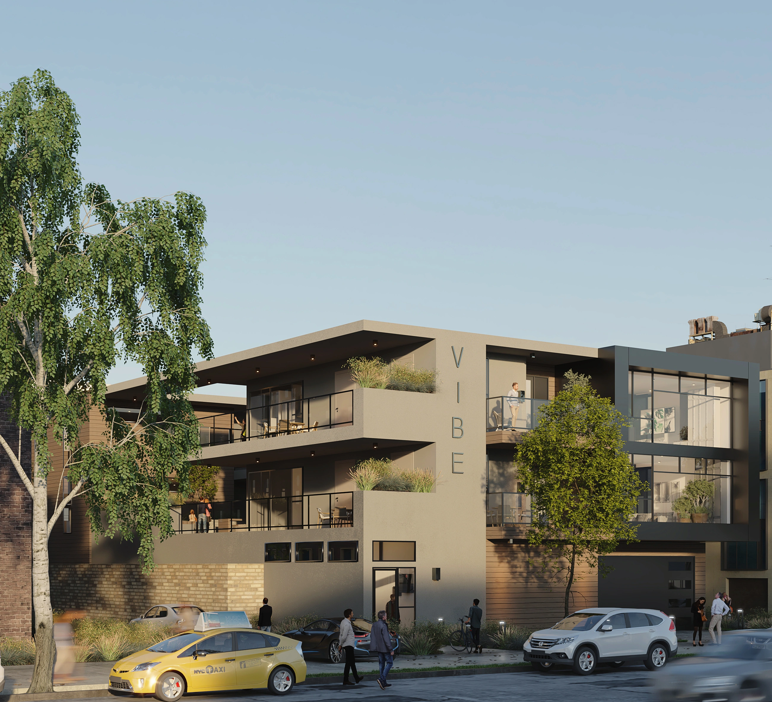 Vibe modern multifamily building front facade with VIBE signage, balconies, and street activity