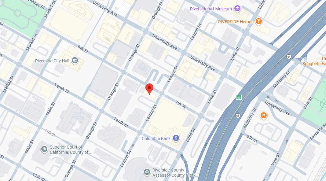 Map showing downtown Riverside, California, highlighting streets such as Lemon St, Orange St, and University Ave with markers for Riverside City Hall, Columbia Bank, and Riverside County Assessor-County Clerk.
