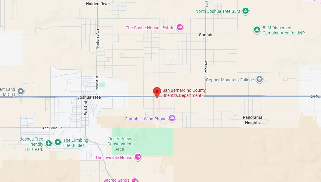 Map showing Joshua Tree area with markers for San Bernardino County Sheriff's Department, Campbell Wind Phone, Joshua Tree Friendly Hills Park, The Climbing Life Guides, Desert View Conservation Area, The Invisible House, Copper Mountain College, and dispersed camping areas.