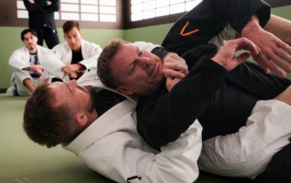 Beginners learning fundamental pins and escapes in weeks 3-4 of ARMA Clapham Beginners Cohort programme