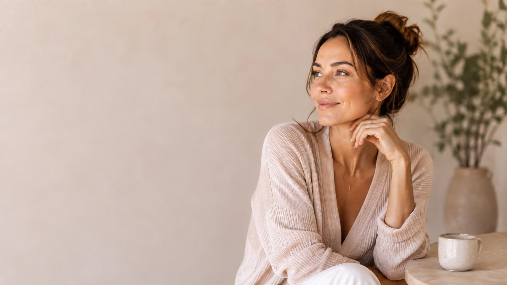 Woman looking thoughtfully in a peaceful room