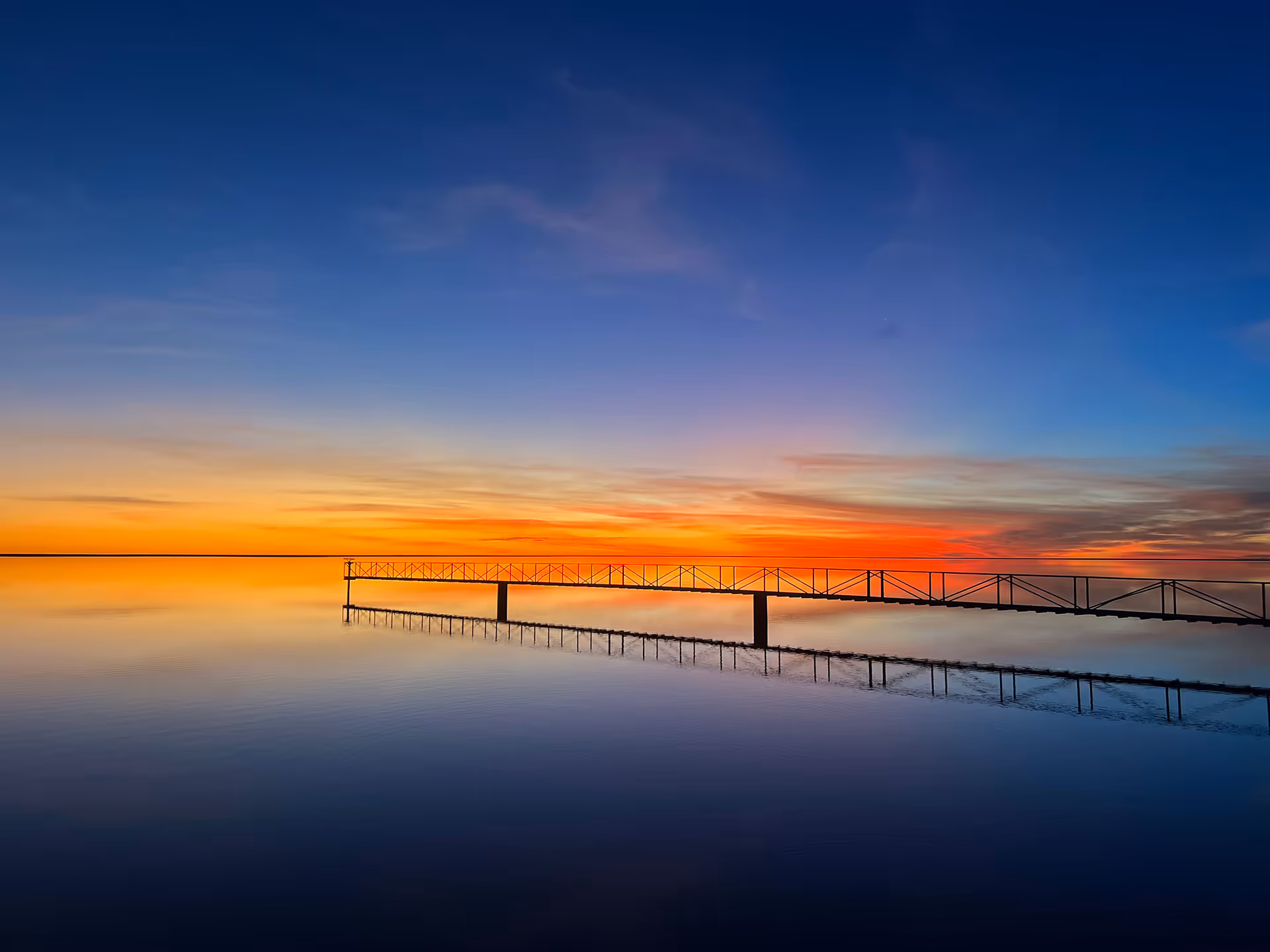Gulf Cotton farm sunset image over water