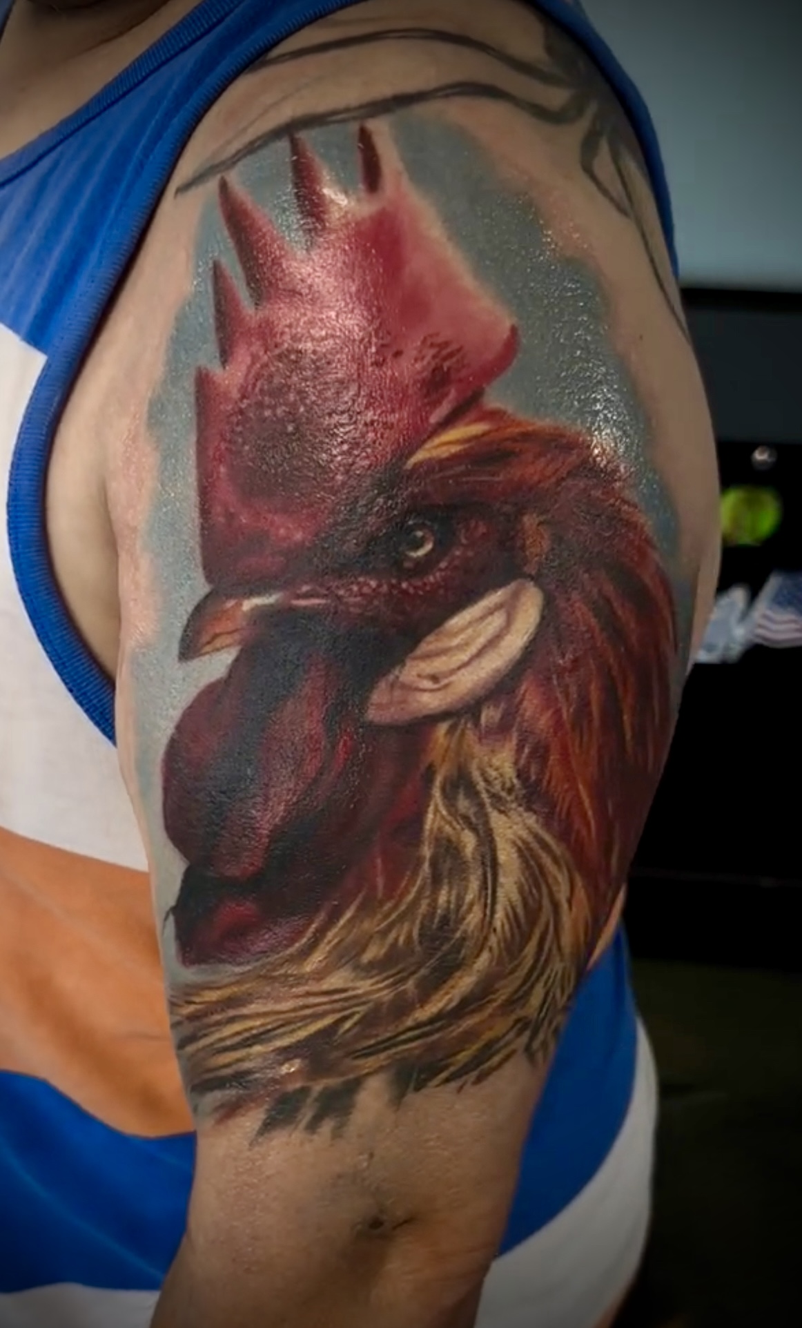 Color realism tattoo of a rooster.