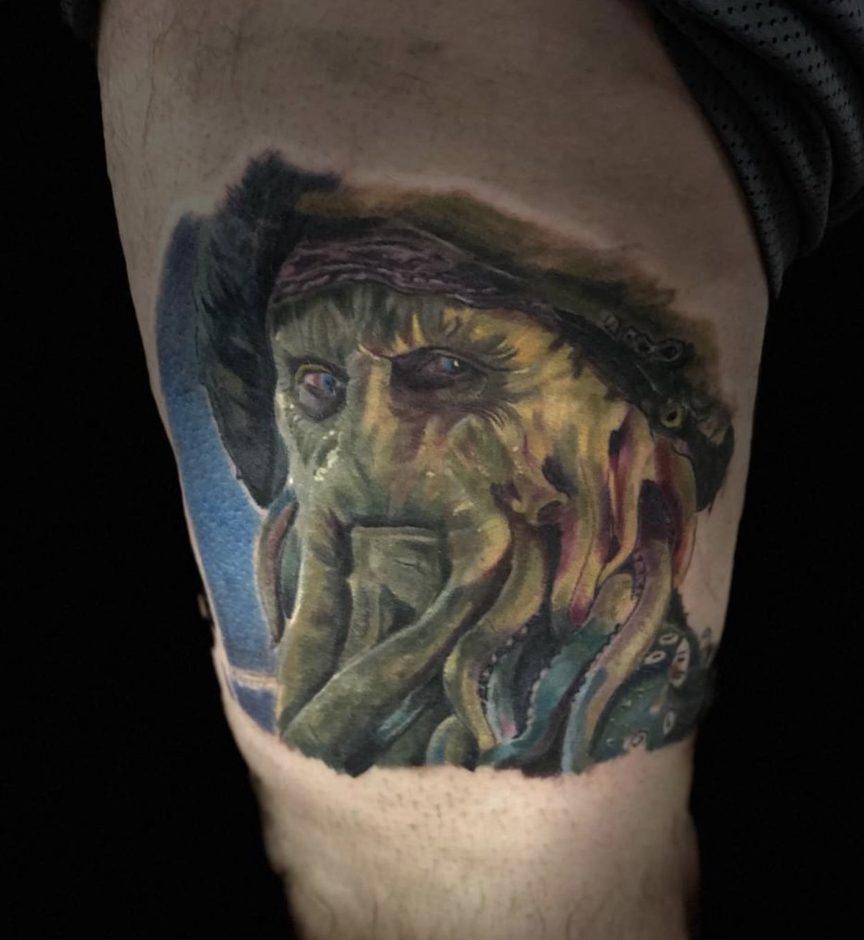 Colorful portrait tattoo of Davy Jones from Pirates of the Caribbean.