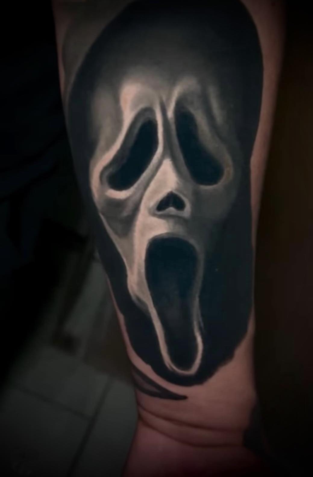 Black and Gray tattoo of the Scream mask.