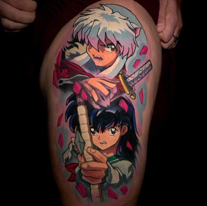 Colorful tattoo of two anime characters.