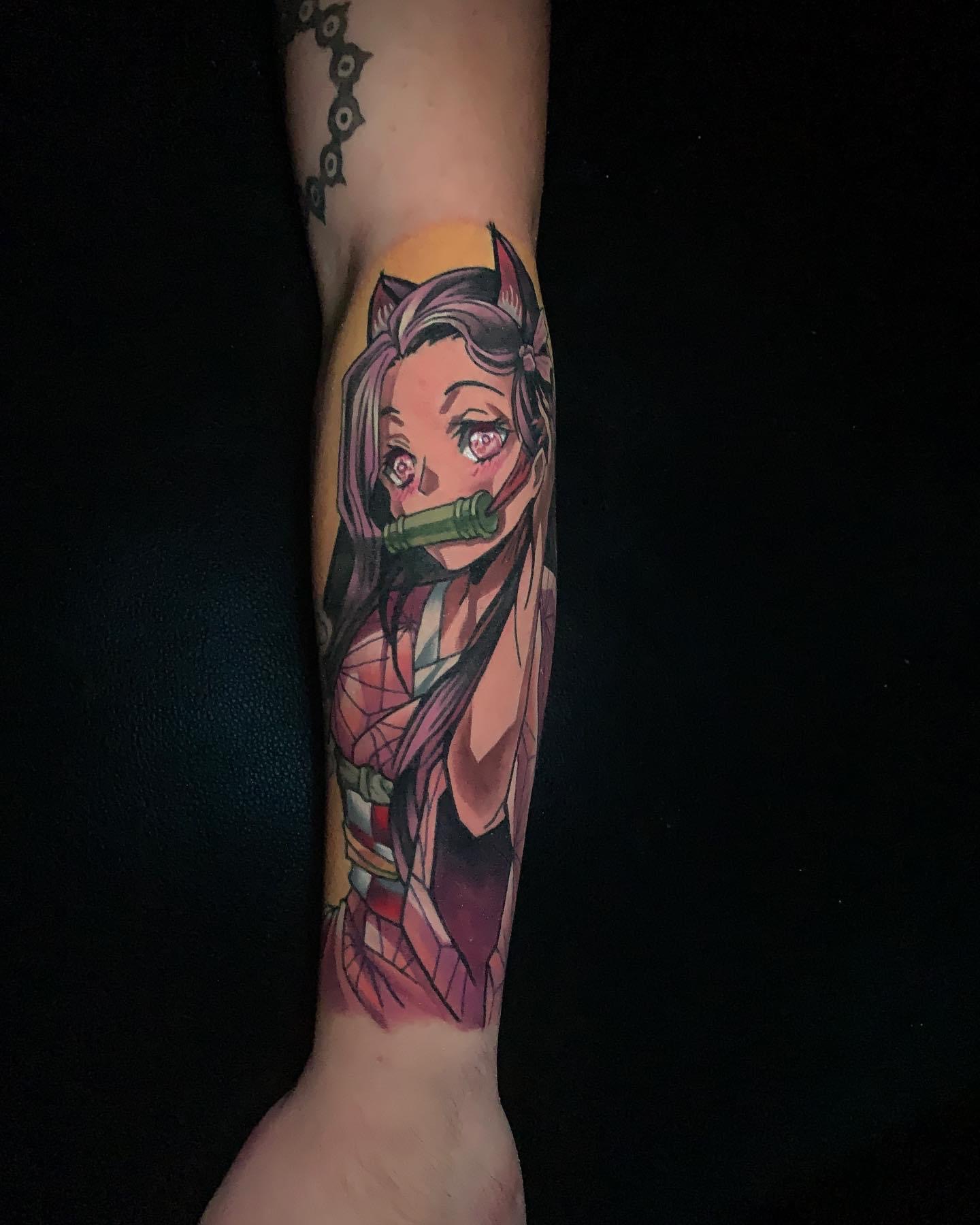 Forearm tattoo of Nezuko Kamado from Demon Slayer.