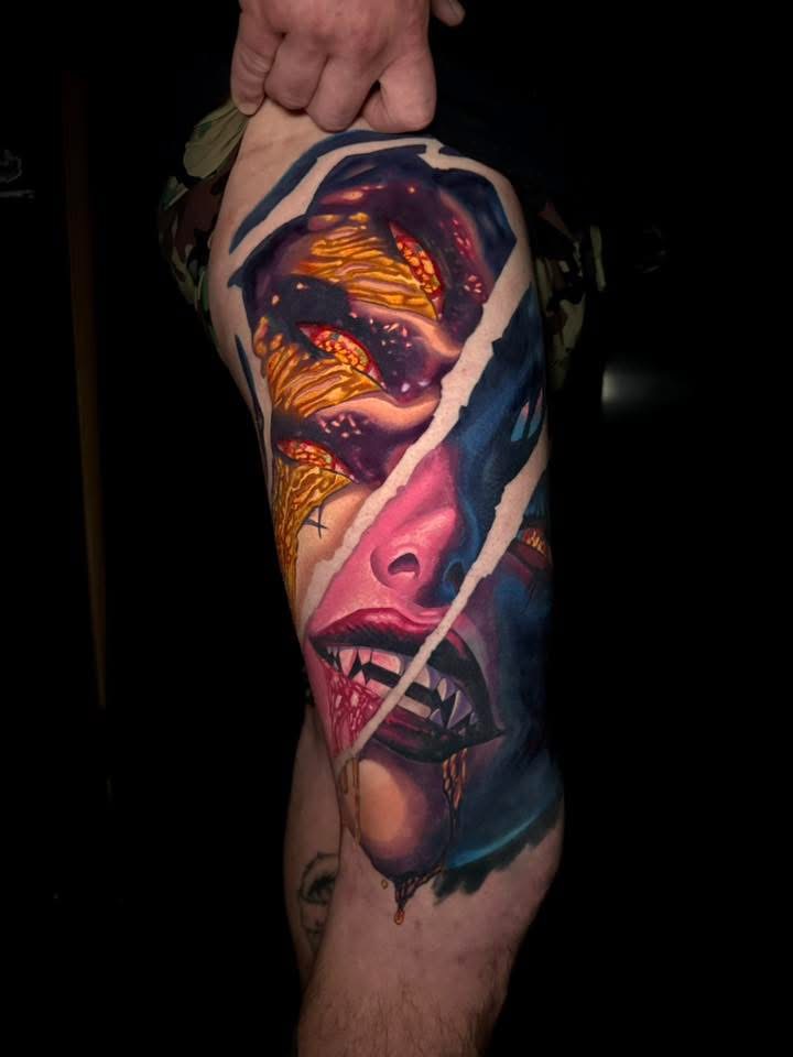Tattoo of vampire mouth with sharp teeth and dripping blood.