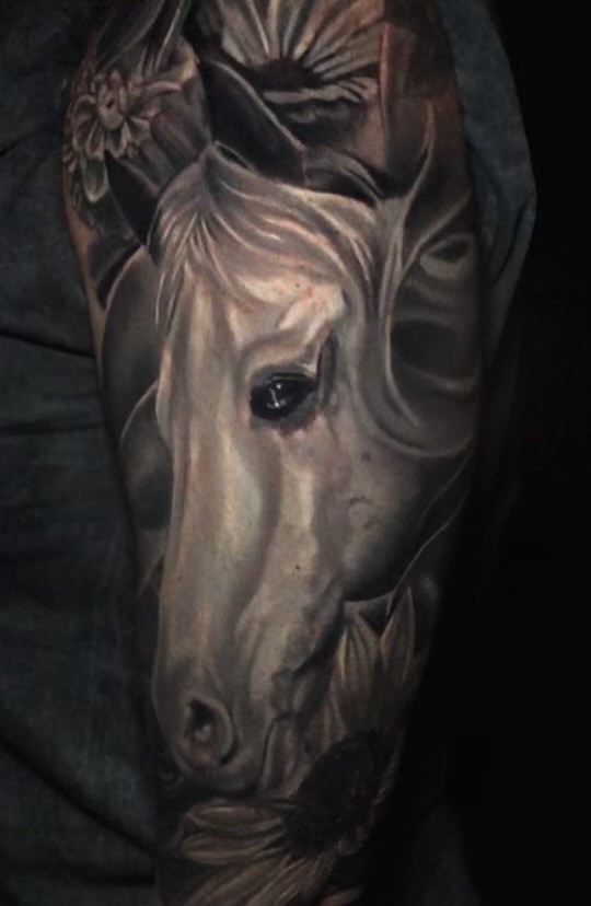 Realistic black and gray horse portrait tattoo