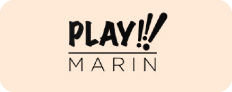 Logo featuring the word PLAY!! in bold uppercase letters above the word MARIN in thin uppercase letters on a light peach background.