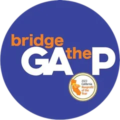 Blue circular logo with the text 'bridge the GAP' in white and orange, including a small badge stating '2023 California nonprofit of the Year'.