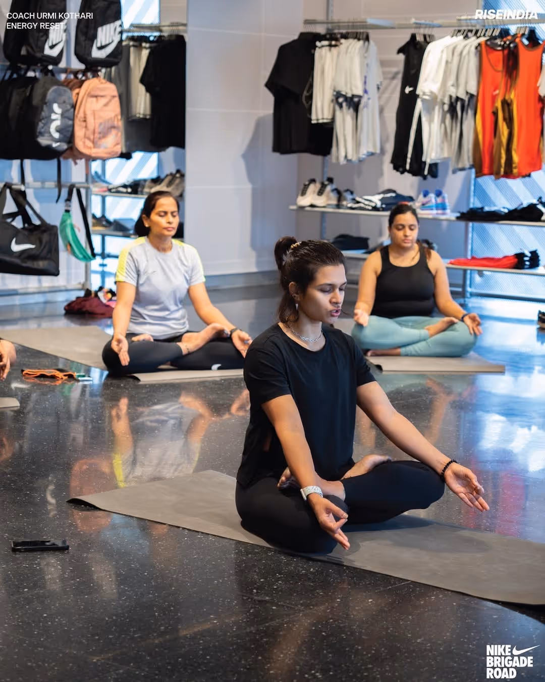 People in a nike store practicing yoga