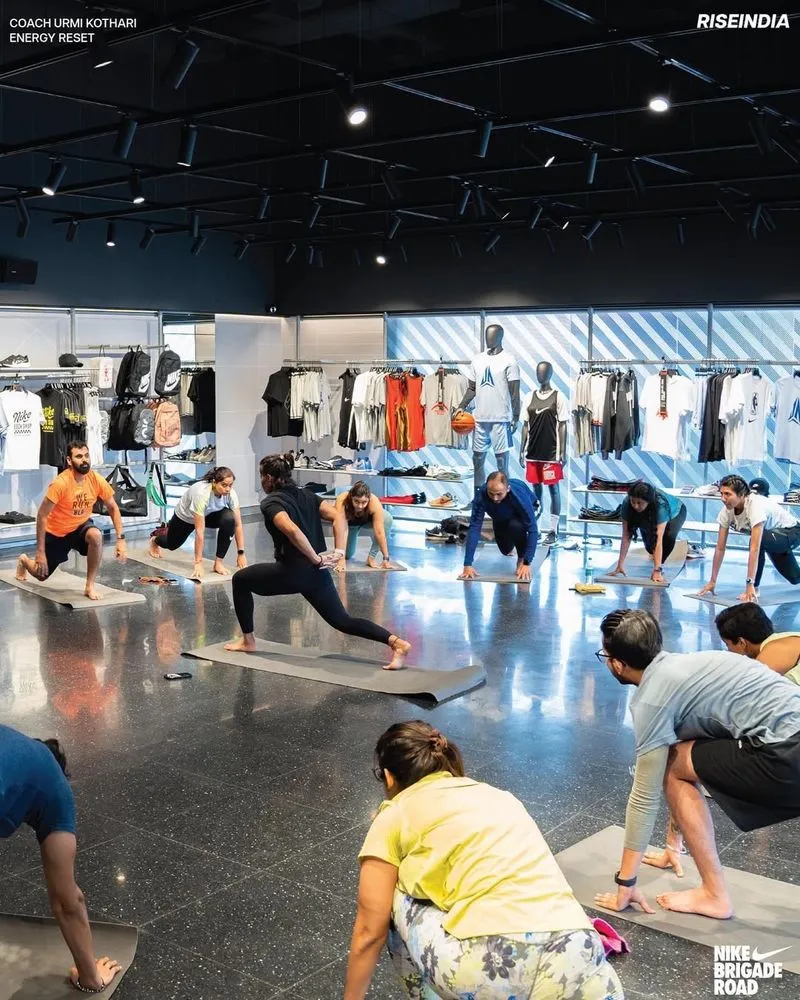 People in a nike store practicing yoga