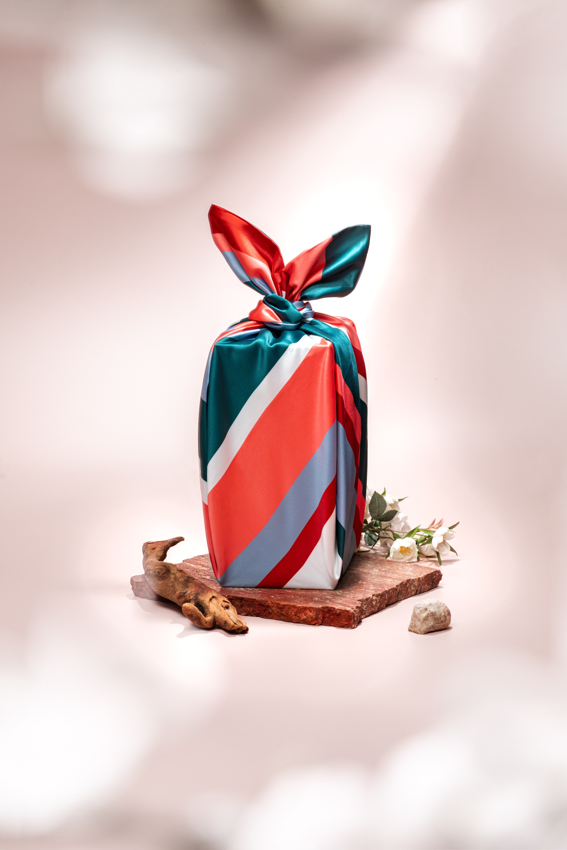 A man standing in front of a blue wall.