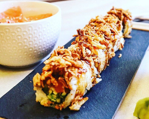Young diverse couple having lunch with junk food