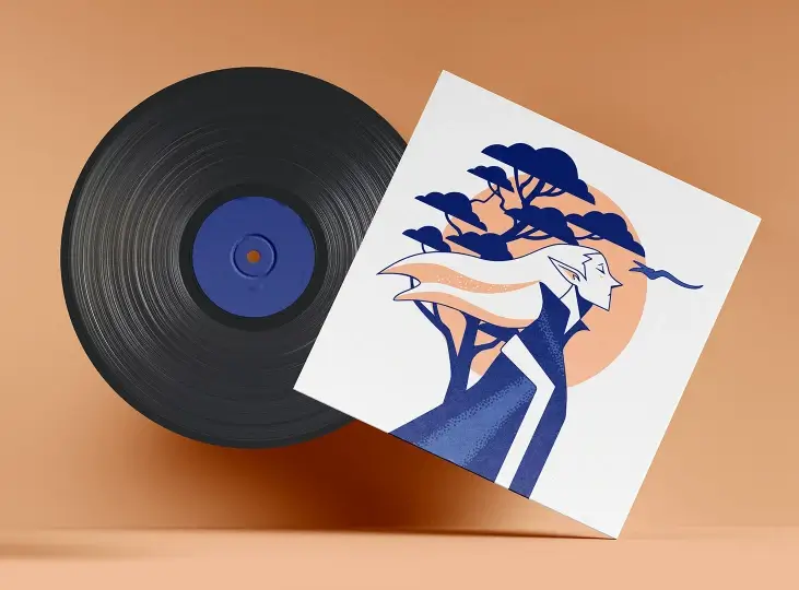 Vinyl record partially covered by an album cover featuring stylized artwork of a person with flowing hair, trees, and a setting sun in blue and peach tones.