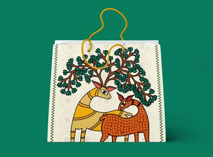 Eco-friendly paper bag with artistic illustration of two deer, one yellow and one orange, with green leafy branches as antlers.