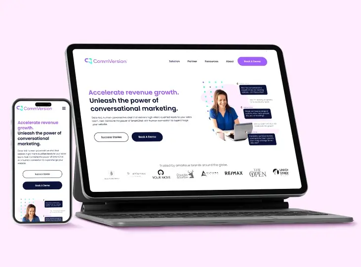 Tablet and smartphone displaying CommVersion website homepage featuring conversational marketing and options to book a demo or view success stories.